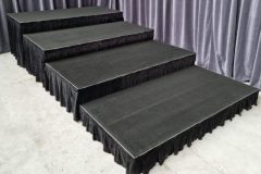 Tiered aluminium stage with skirting